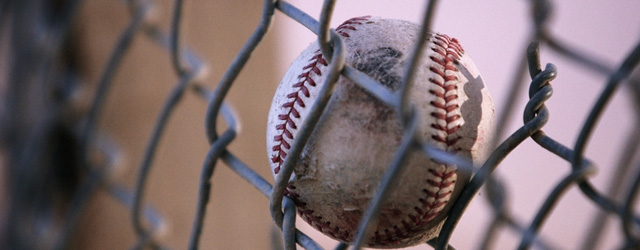 Baseball Hit into Fence